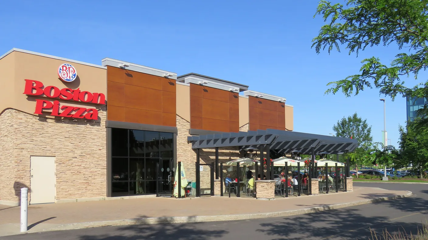 A Boston Pizza restaurant with a covered outdoor terrace